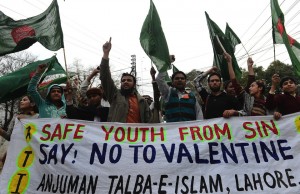 Pakistani youth shout slogans against Valentine's Day in Lahore on February 14, 2013. Pakistan's media regulator Wednesday asked  television and radio stations to avoid offending religious sentiments and corrupting the nation's youth in their Valentine's Day broadcasts.  AFP PHOTO/Arif ALI        (Photo credit should read Arif Ali/AFP/Getty Images)